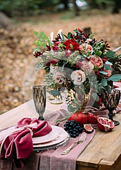 Rustic wedding decoration for festive table with beautiful flower composition. Autumn wedding. Artwork