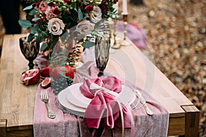 Rustic wedding decoration for festive table with beautiful flower composition. Autumn wedding. Artwork