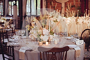 Rustic wedding decorations with flowers and candles. banquet decor.