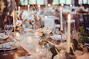 Rustic wedding decorations with flowers and candles. banquet decor.