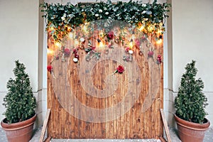 Rustic wedding photo zone. Hand made wedding decorations includes Photo Booth red flowers.