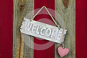 Rustic welcome sign with hanging heart