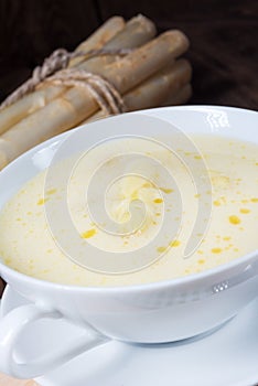 Rustic white asparagus cream soup with butter