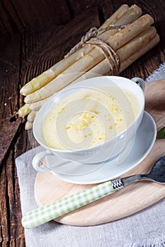 Rustic white asparagus cream soup with butter