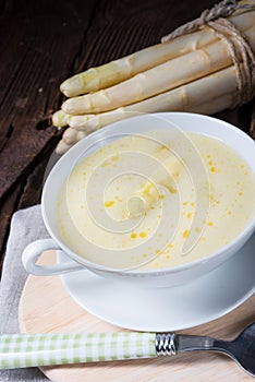 Rustic white asparagus cream soup with butter