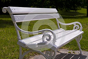 Rustic white bench in park close up