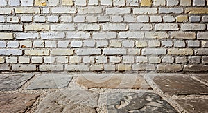 Rustic white brick wall and flagstone floor texture