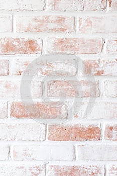 Rustic whitewashed brick wall texture with red accents