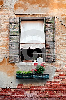 Rustic window with shutters in old venice house