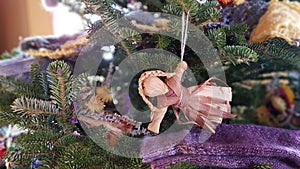 Rustic winter holidays decorations on a Christmas tree