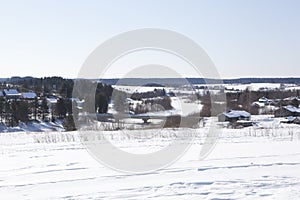 Rustic, winter landscape. Bridge over the river in the village of Waga Shelota, Verhovazhskogo District, Vologda Region