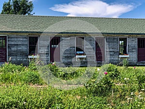 Rustic wood building with colored doors