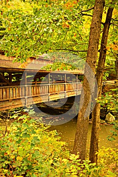 A Rustic Wood Covered Bridge During Autumn photo