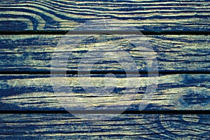 Rustic wood planks closeup. Rough lumber surface. Blue toned wooden background for vintage card.