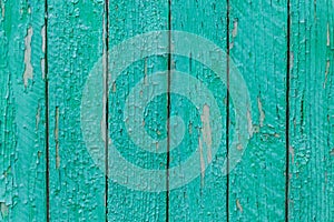 Rustic wood texture or background with scratched turquoise paint