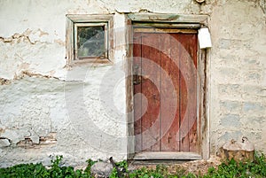 Rustic wooden barn door with white milk can