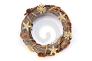 Rustic wooden Christmas wreath with pine cones isolated on whote background Natural Christmas decoration photo