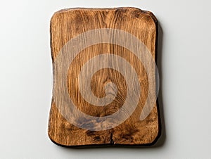 Rustic wooden cutting board on white background