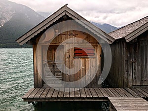 Rustic wooden house on a lake.