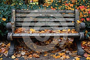 Rustic wooden park bench surrounded by vibrant autumn leaves in a peaceful park. AI generated.