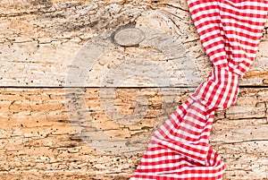 Rustic wooden table background for menu card with red checked tablecloth