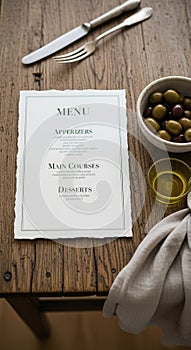 A rustic wooden table holds a menu featuring sections for appetizers, main courses,
