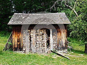 Rustic Woodshed Stocked for Winter