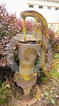 Rustic Yellow Well Pump - Antique