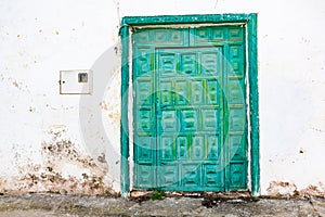 Rustical abandoned old house with weathered green door in Beautiful village of Haria, Lanzarote, Canary Islands, Spain
