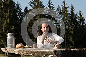 Rustically man making a picnic in the nature