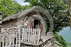 Rustici, traditional stone houses in the mountains at lake Maggiore. Piedmont, Italy. photo