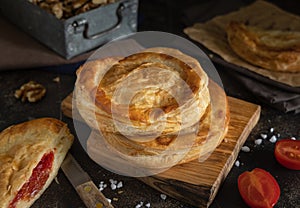 Rustico puff pastry from Lecce filled with stuffed with tomato, mozzarella and bechamel sauce photo