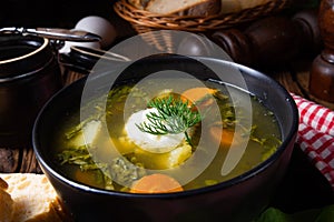 A Rustikal Sorrel soup with potatoes and cream photo