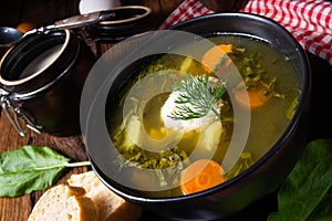 Rustikal Sorrel soup with potatoes and cream photo