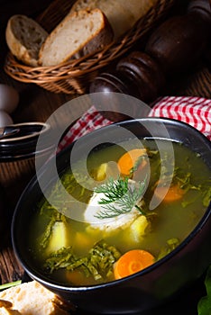 Rustikal Sorrel soup with potatoes and cream photo
