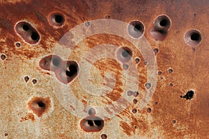 Rusting bullet holes background
