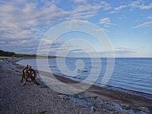 A rusting derelict Boat winch on the shingle beach of Tangle Ha on the East Coast of Scotland.