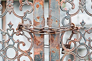 Rusting gate locked with chain