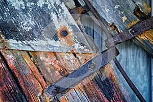 Rusting Iron and Weathered wood on old Rudder