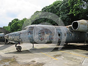 A rusting plane in a car park in Yangon, Myanmar