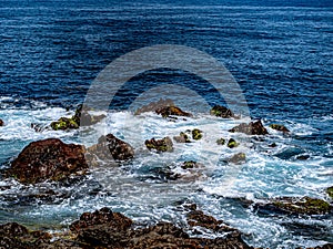 The rustling of the Atlantic over rocks of time