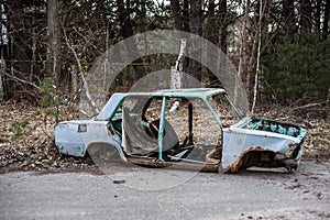 Rusty and abandoned car in Chernobyl Exclusion Zone