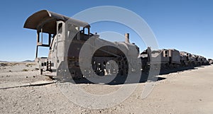Rusty and abandoned old trains at the Train Cemetery Cementerio de Trenes in Uyuni desert, Bolivia
