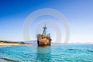 Rusty and abandoned shipwreck on a coastline near Gythio in Lakonia, Peloponnese Greece