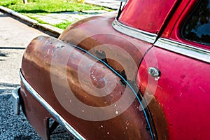 Rusty american classic car parked on the street