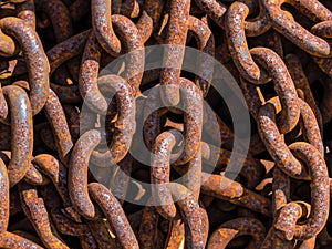 rusty anchor chains in a harbor