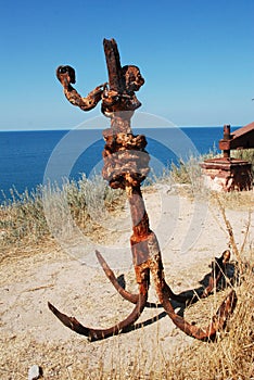 Rusty anchor on the coast
