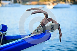 A rusty anchor on a traditional fishing boat.