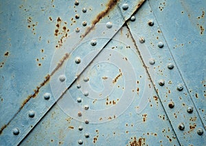 Rusty background with metal rivets