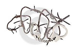 Rusty barbed wire and handcuffs on white background